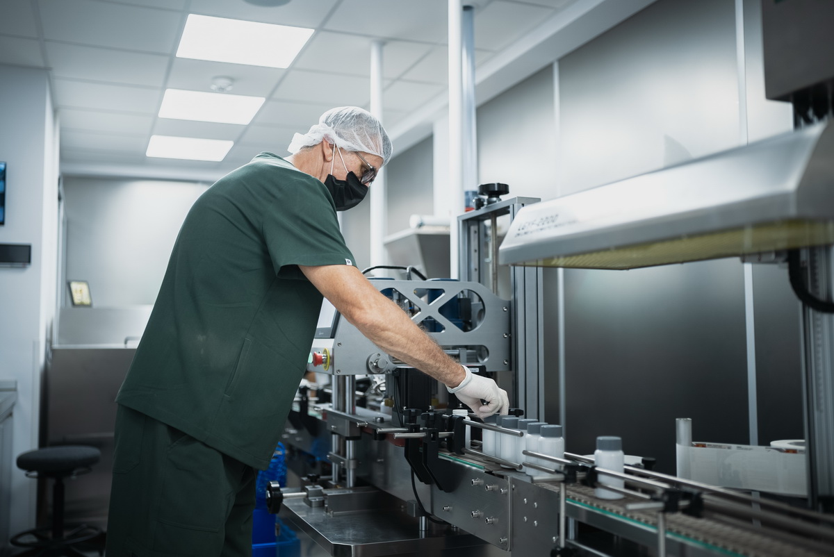 SEMACO employee operating manufacturing equipment