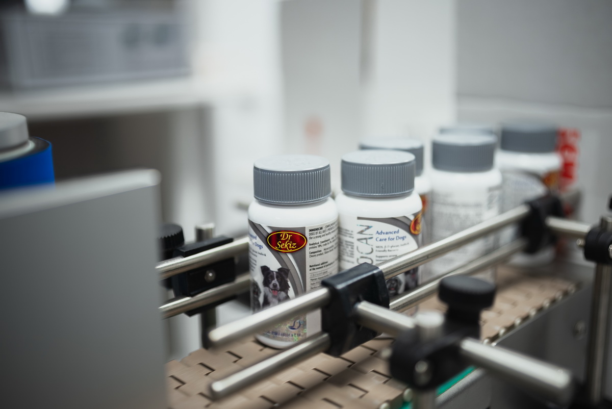 Finished SEMACO product bottles moving along the production line